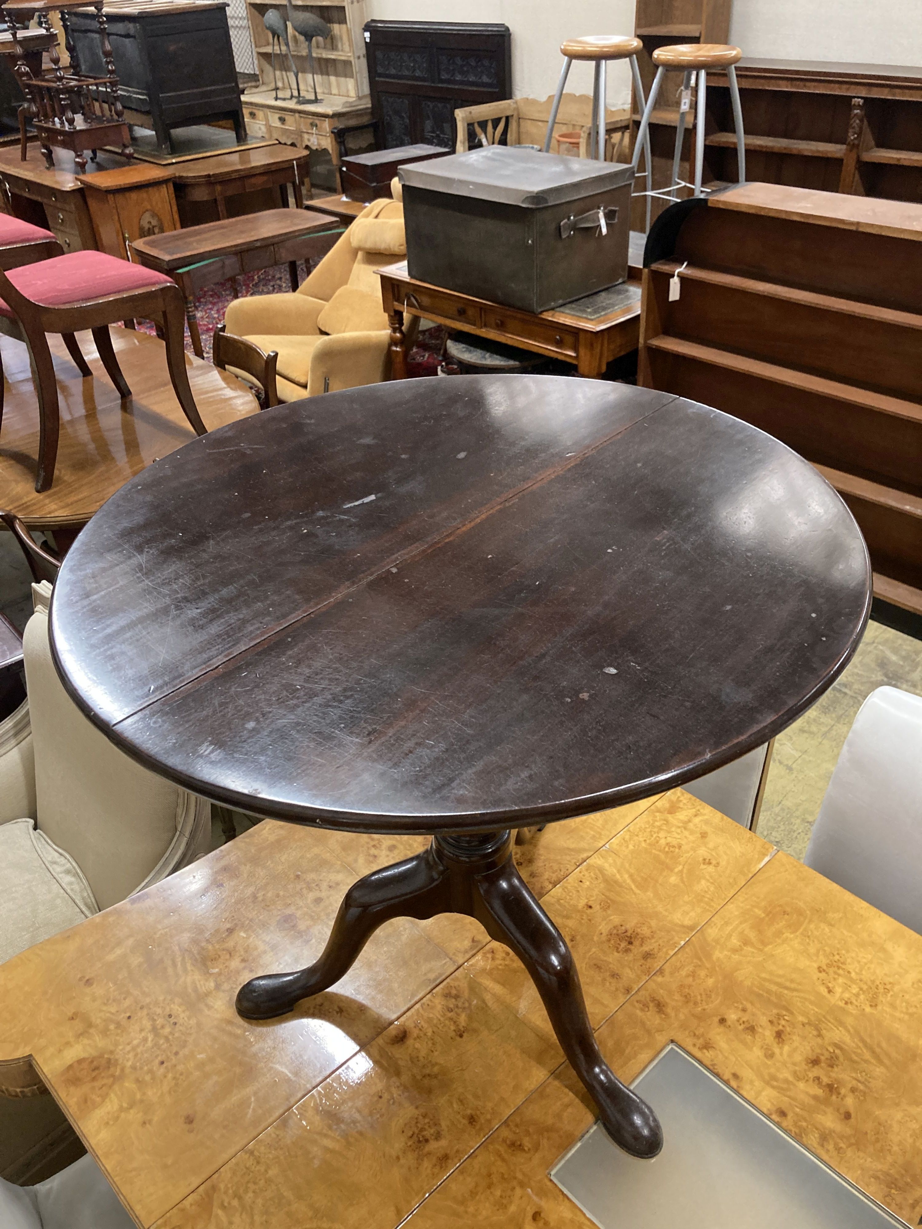 A George III circular mahogany tilt top birdcage tea table, 76cm diameter, 69cm high